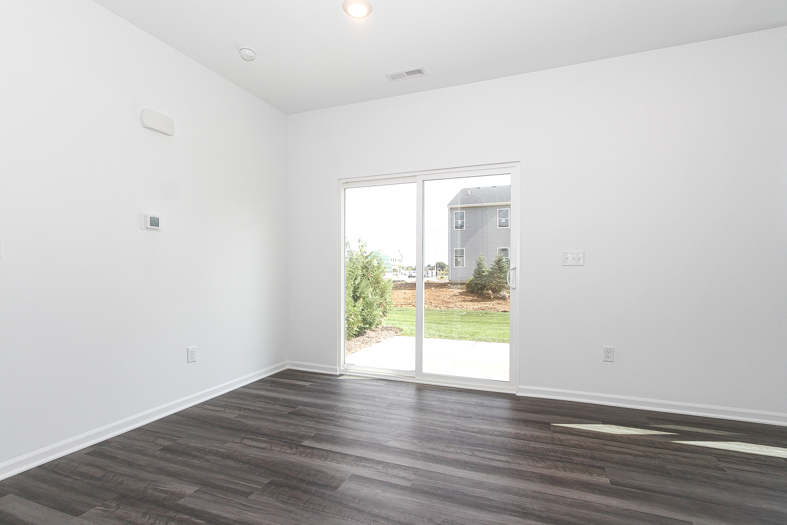 451 Comstock Road South Elgin, IL 60177 - Photo 12 of 30 a view of a room with wooden floor and a window