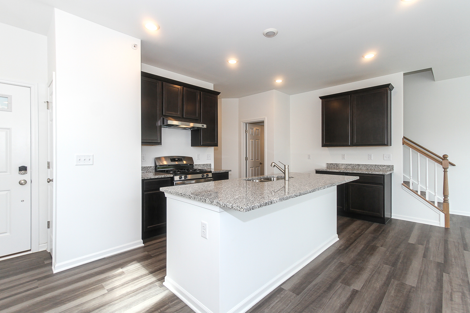 451 Comstock Road South Elgin, IL 60177 - Photo 7 of 30 a kitchen with a sink stove and refrigerator