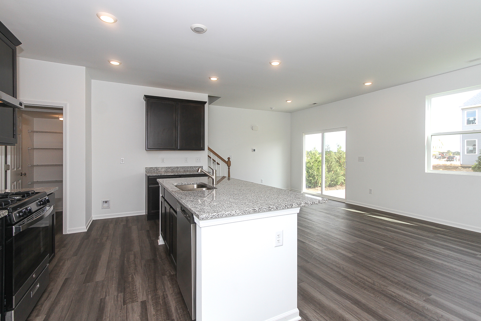 451 Comstock Road South Elgin, IL 60177 - Photo 8 of 30 a kitchen with a sink stove and refrigerator