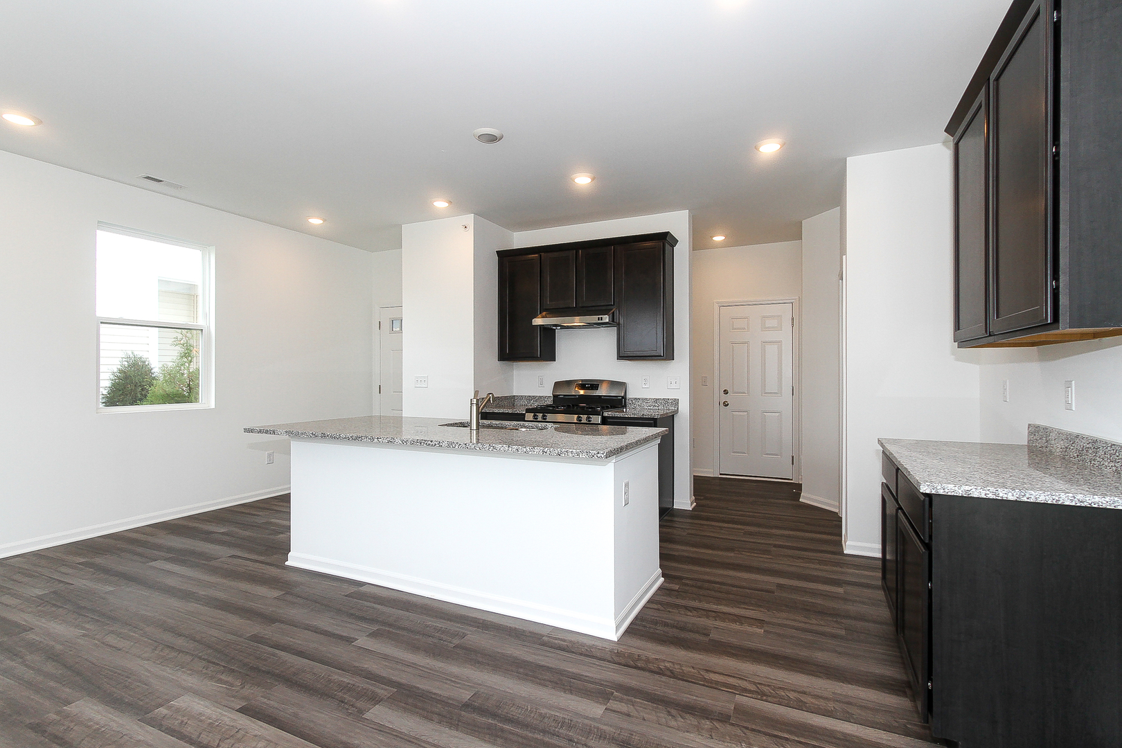 451 Comstock Road South Elgin, IL 60177 - Photo 10 of 30 a large kitchen with stainless steel appliances granite countertop a stove a sink and a refrigerator