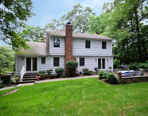 4 Barringer Road Darien, CT 06820 - Photo 17 of 19 a front view of a house with a garden and plants