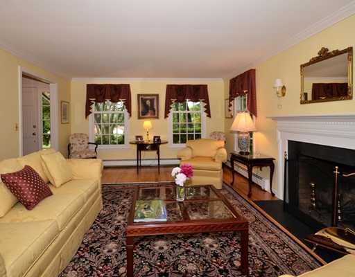 4 Barringer Road Darien, CT 06820 - Photo 4 of 19 a living room with furniture fireplace and rug