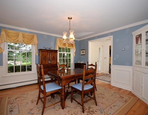 4 Barringer Road Darien, CT 06820 - Photo 7 of 19 a dining room with furniture a chandelier and wooden floor
