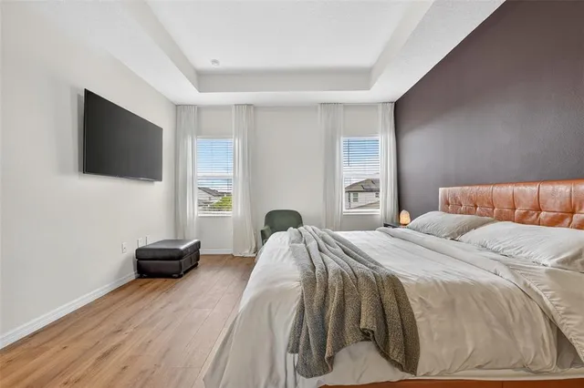 a bedroom with a bed and a couch