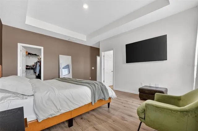 a bathroom with a double vanity sink toilet and shower