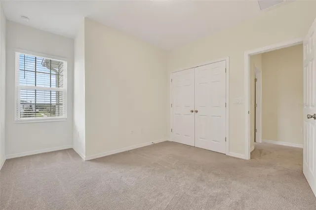 a bedroom with a bed and a television in it