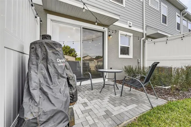 a view of a chairs and table in the patio