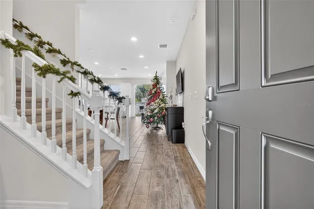 a view of entryway with stairs and wooden floor