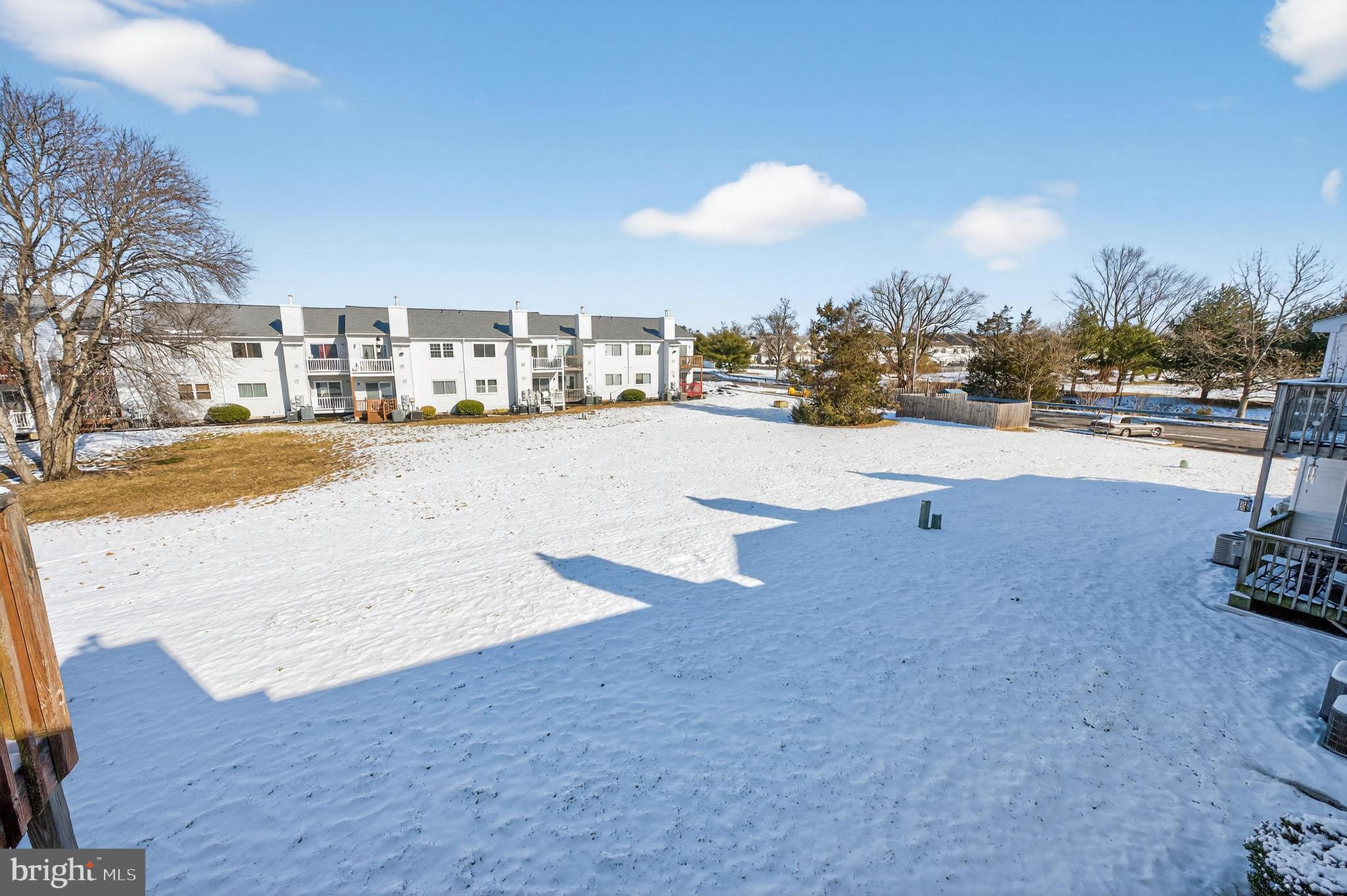 909 Woodchip Road Lumberton, NJ 08048 - Photo 5 of 20 Serene winter landscape with snow-covered ground.