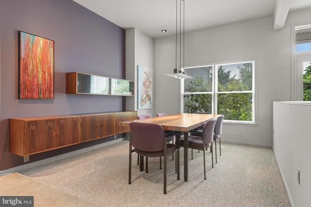 a kitchen with a sink a counter top space cabinets and stainless steel appliances