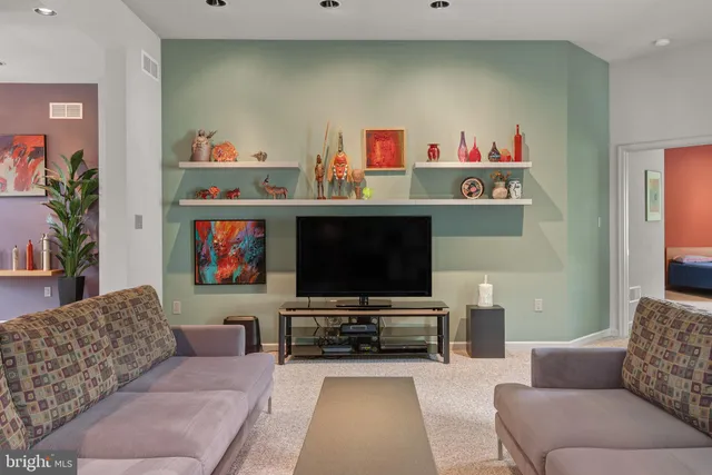 a living room with furniture and a area