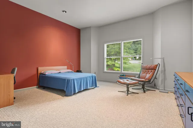 a bathroom with a bathtub sink and mirror