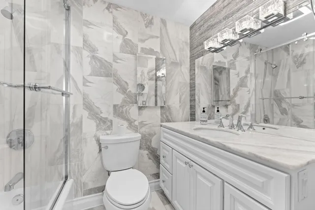 a view of a room with wooden floor and a window