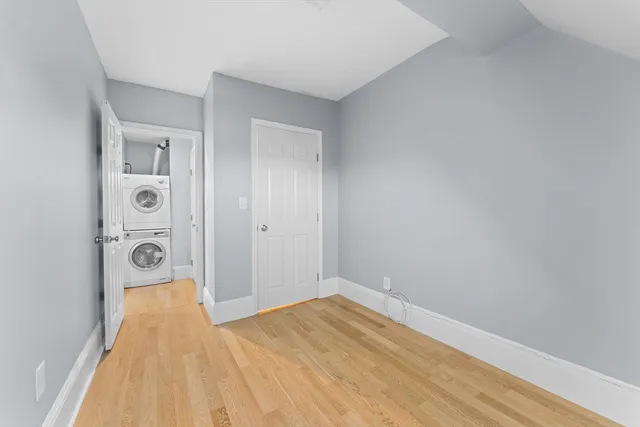a view of a hallway with washer and dryer