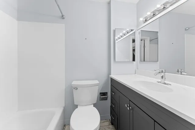 a view of a livingroom with wooden floor and stairs