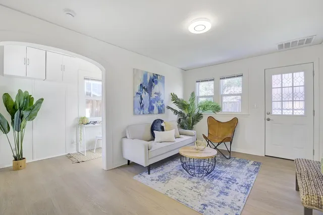 a living room with furniture and a rug