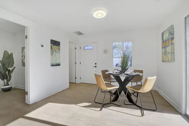 a view of a livingroom with furniture and a potted plant