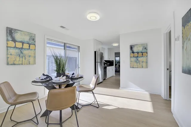 a kitchen with stainless steel appliances a stove a microwave and cabinets