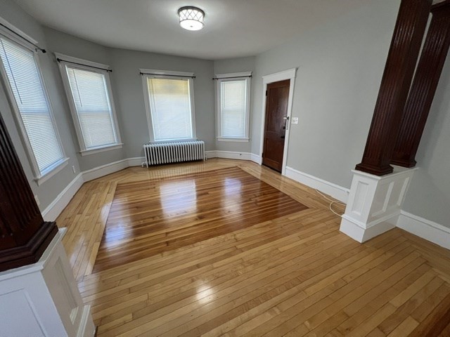 0 Lafayette Street, Unit 1 Fall River, MA 02723 - Photo 8 of 13 a view of empty room with wooden floor and fan