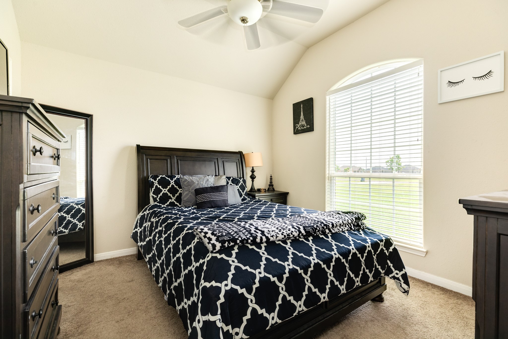 920 Quarter Horse Trail Angleton, TX 77515 - Photo 16 of 21 a bed sitting in a bedroom next to a window