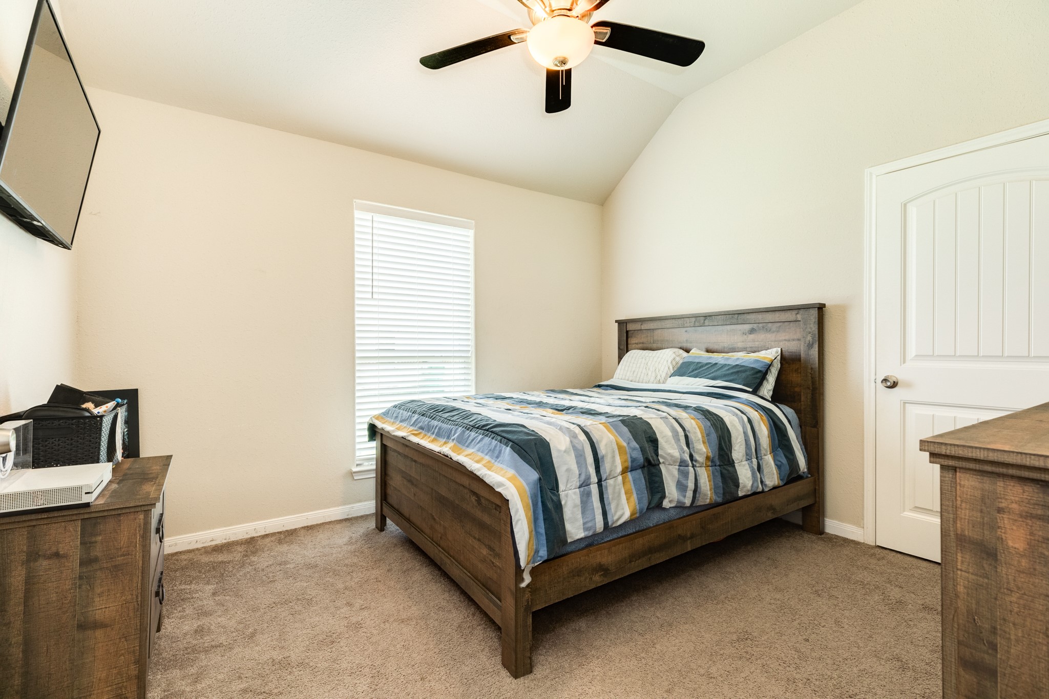 920 Quarter Horse Trail Angleton, TX 77515 - Photo 17 of 21 a bedroom with a bed and a television