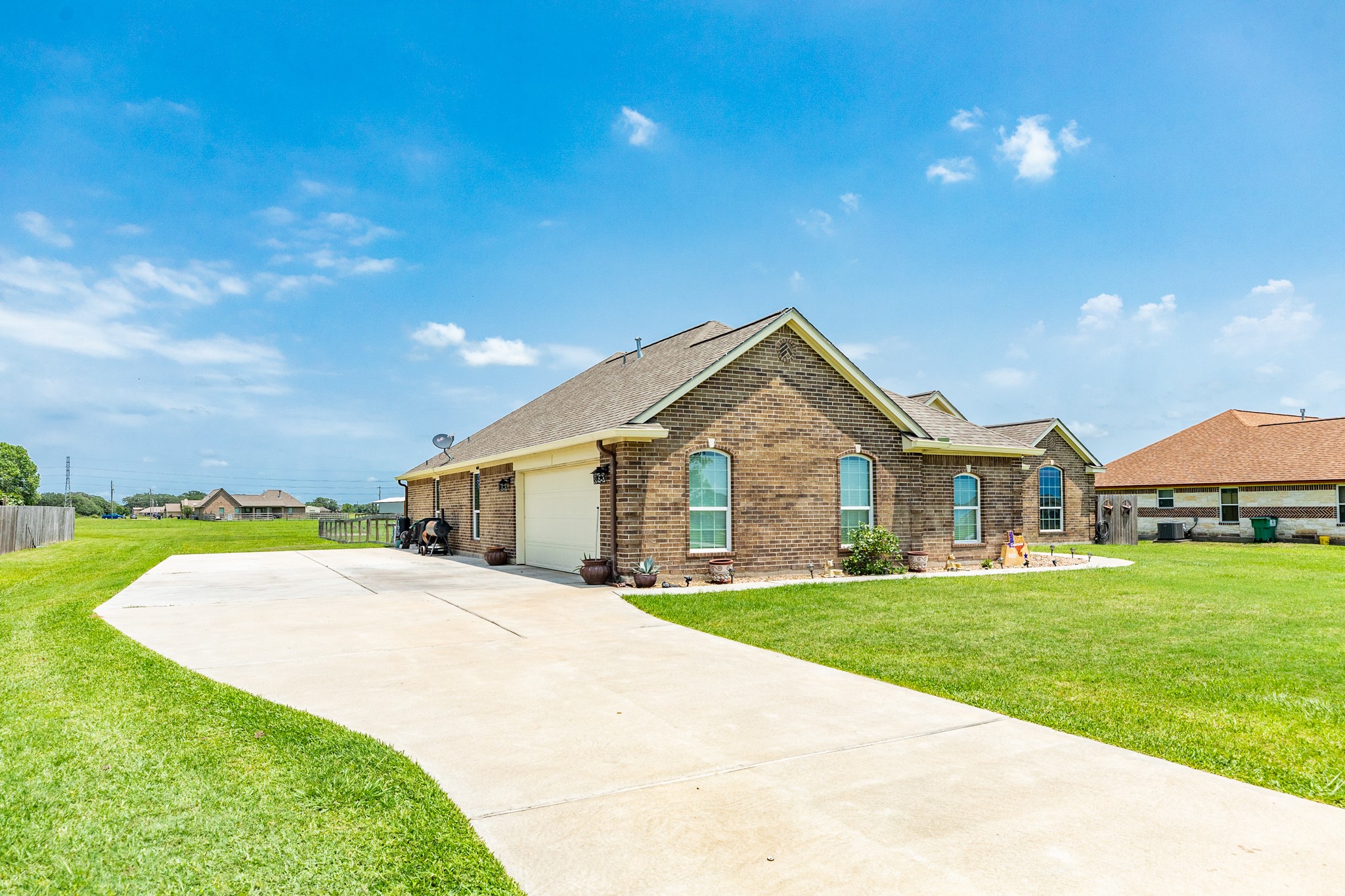 920 Quarter Horse Trail Angleton, TX 77515 - Photo 2 of 21 a front view of a house with a yard