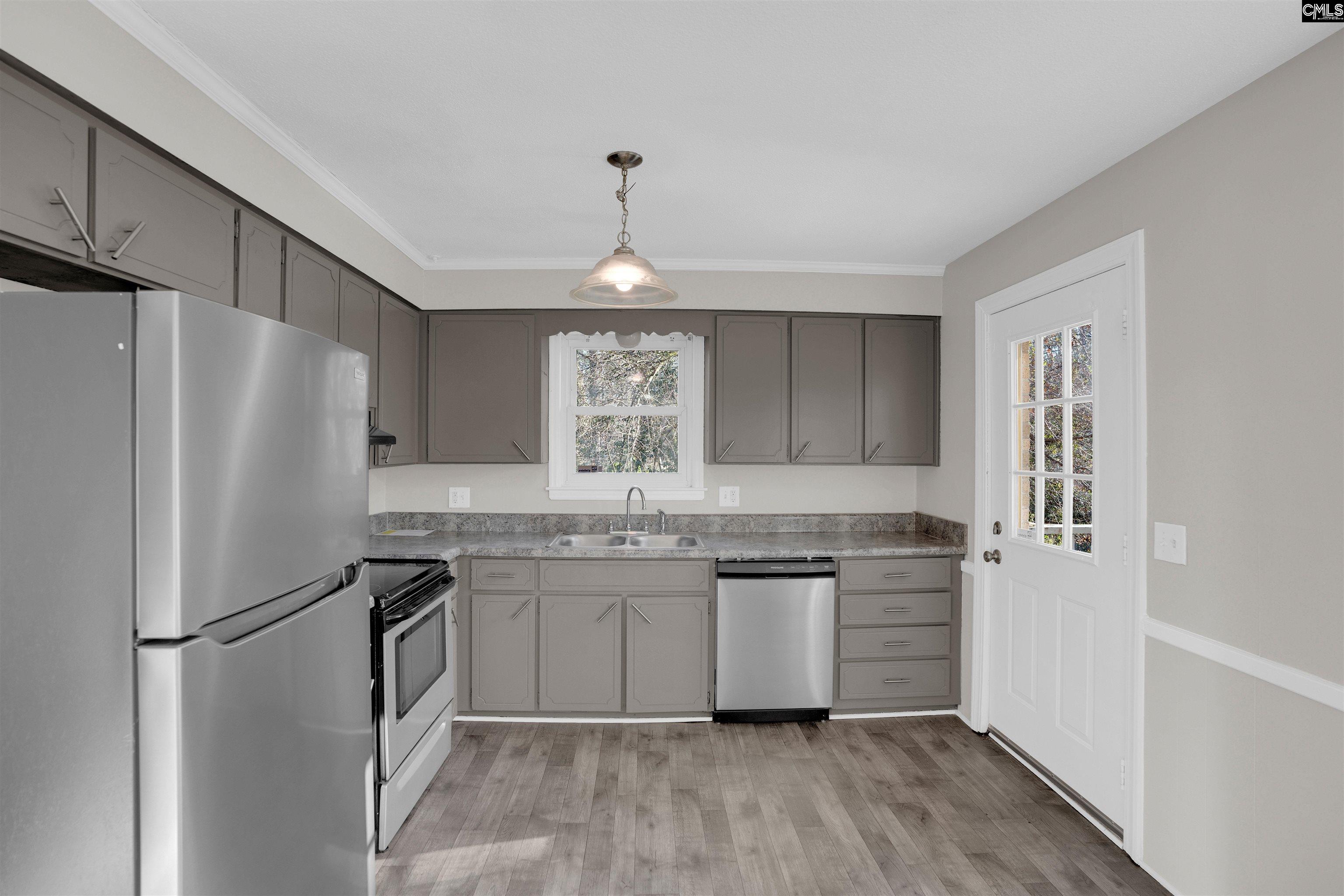 2620 Pleasant Ridge Drive Columbia, SC 29209 - Photo 12 of 37 a kitchen with stainless steel appliances a refrigerator sink and cabinets