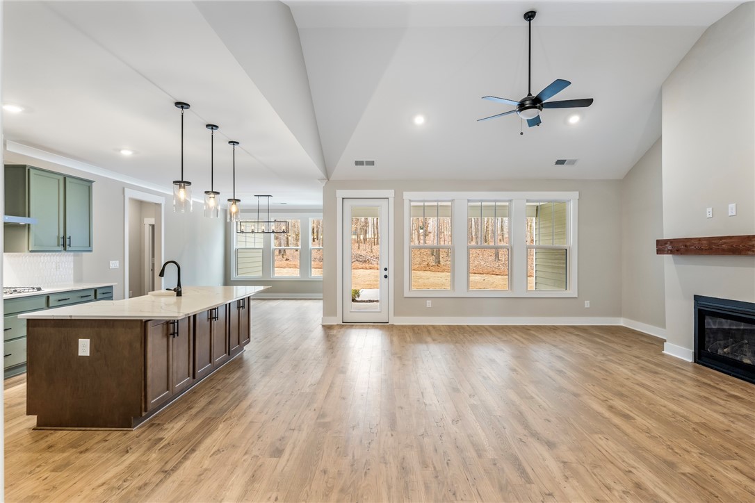 117 Falcon Crest Way Pickens, SC 29671 - Photo 2 of 6 Bright and airy living space featuring an open concept design and rich wood flooring.