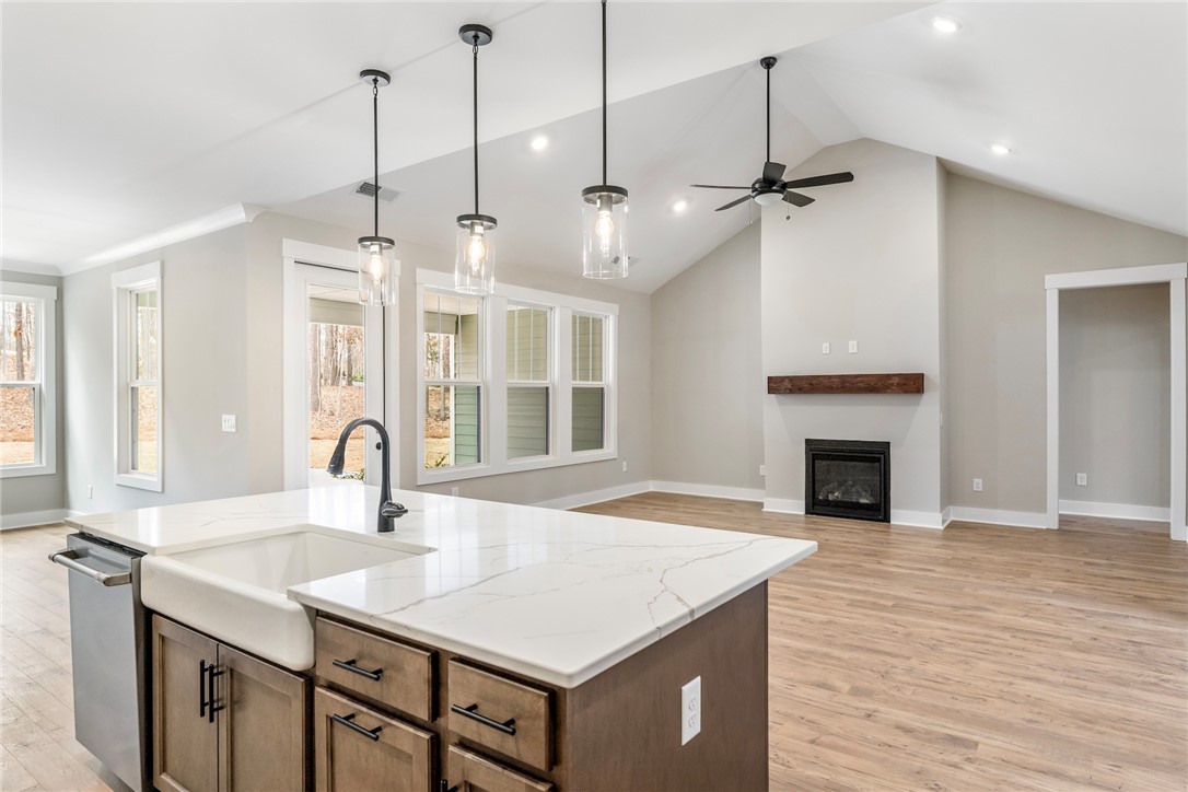 117 Falcon Crest Way Pickens, SC 29671 - Photo 6 of 6 This bright interior showcases an open layout with elegant fixtures and a cozy fireplace.