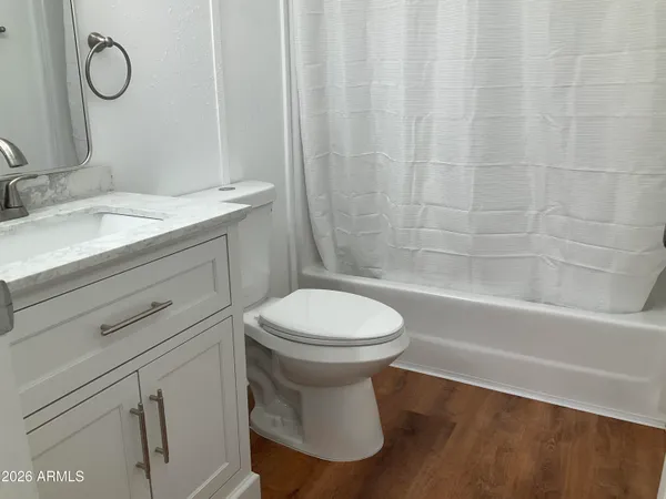 a view of cabinets and wooden floor