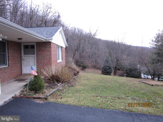 7108 Edgemont Road Frederick, MD 21702 - Photo 1 of 15 a view of a house with a yard and large tree