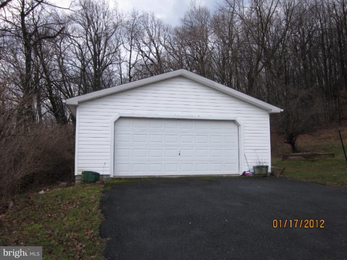 7108 Edgemont Road Frederick, MD 21702 - Photo 2 of 15 a backyard of a house with garage