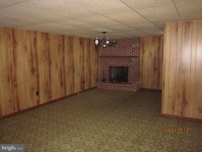 7108 Edgemont Road Frederick, MD 21702 - Photo 3 of 15 a view of empty room with fireplace