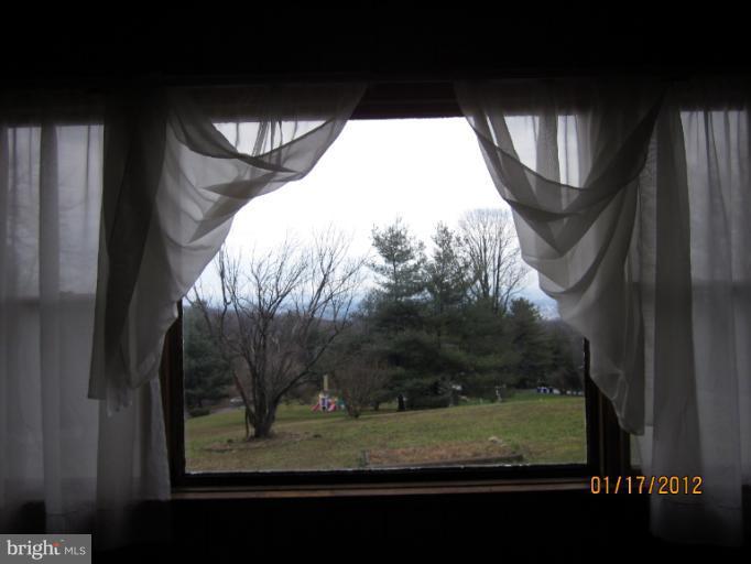 7108 Edgemont Road Frederick, MD 21702 - Photo 5 of 15 a view of a window of a yard