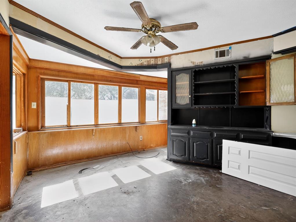 3216 Rotan Lane Dallas, TX 75229 - Photo 12 of 28 a kitchen with a large window appliances and cabinets