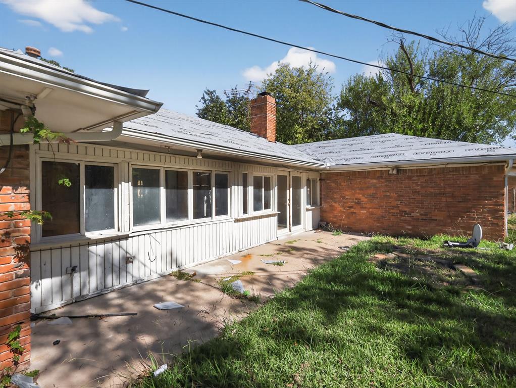 3216 Rotan Lane Dallas, TX 75229 - Photo 27 of 28 front view of a house with a big yard
