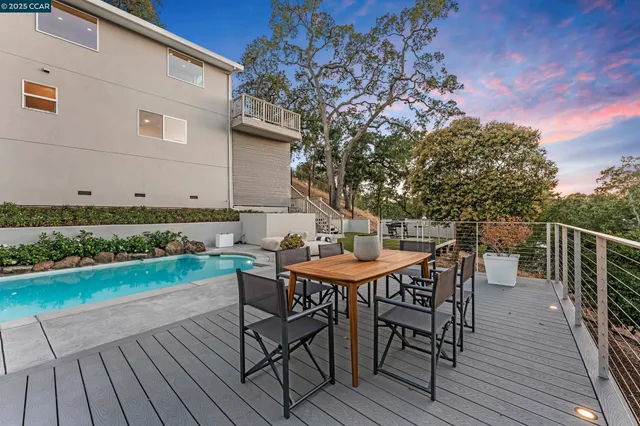an aerial view of a house with yard swimming pool and outdoor seating