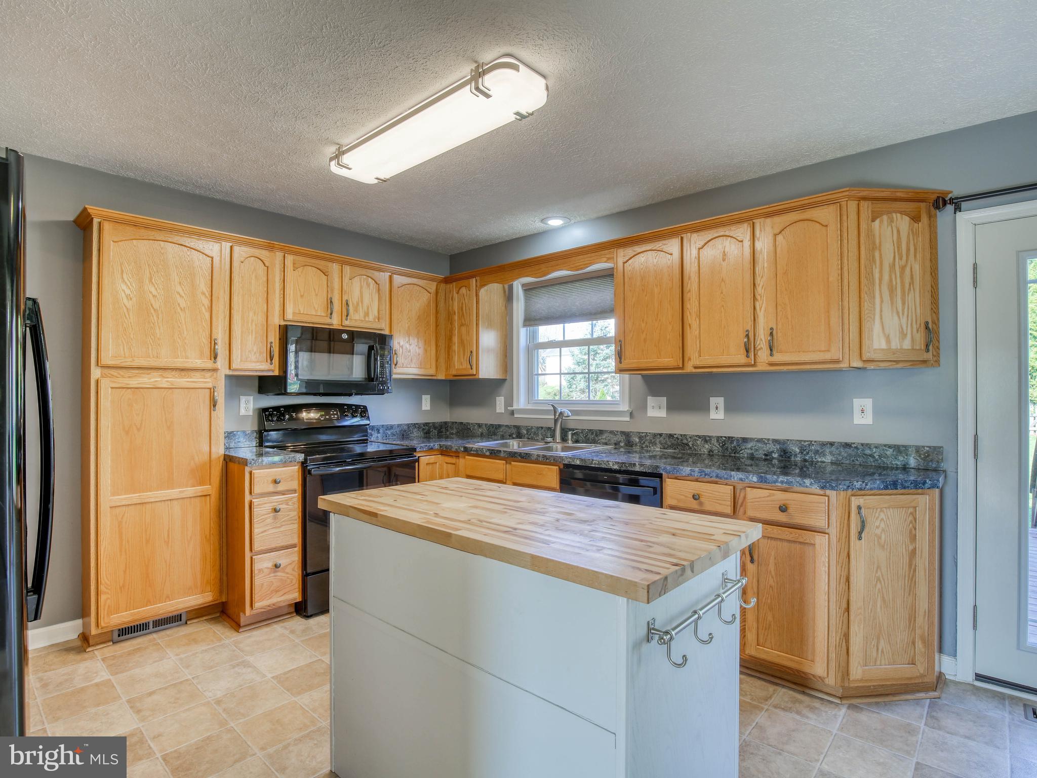 30 Flopsy Court Ranson, WV 25438 - Photo 5 of 50 Kitchen with butcher butcherblock-topped island