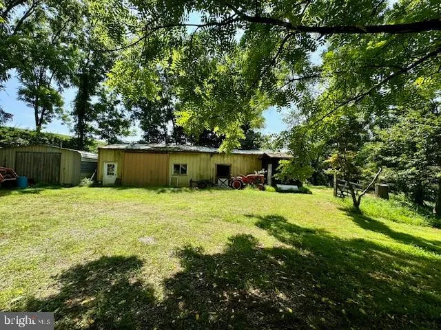 a view of backyard with green space