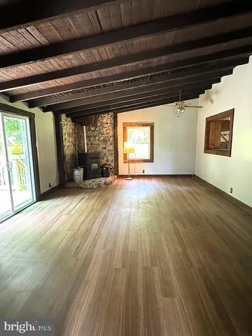 a view of a fireplace with wooden floor