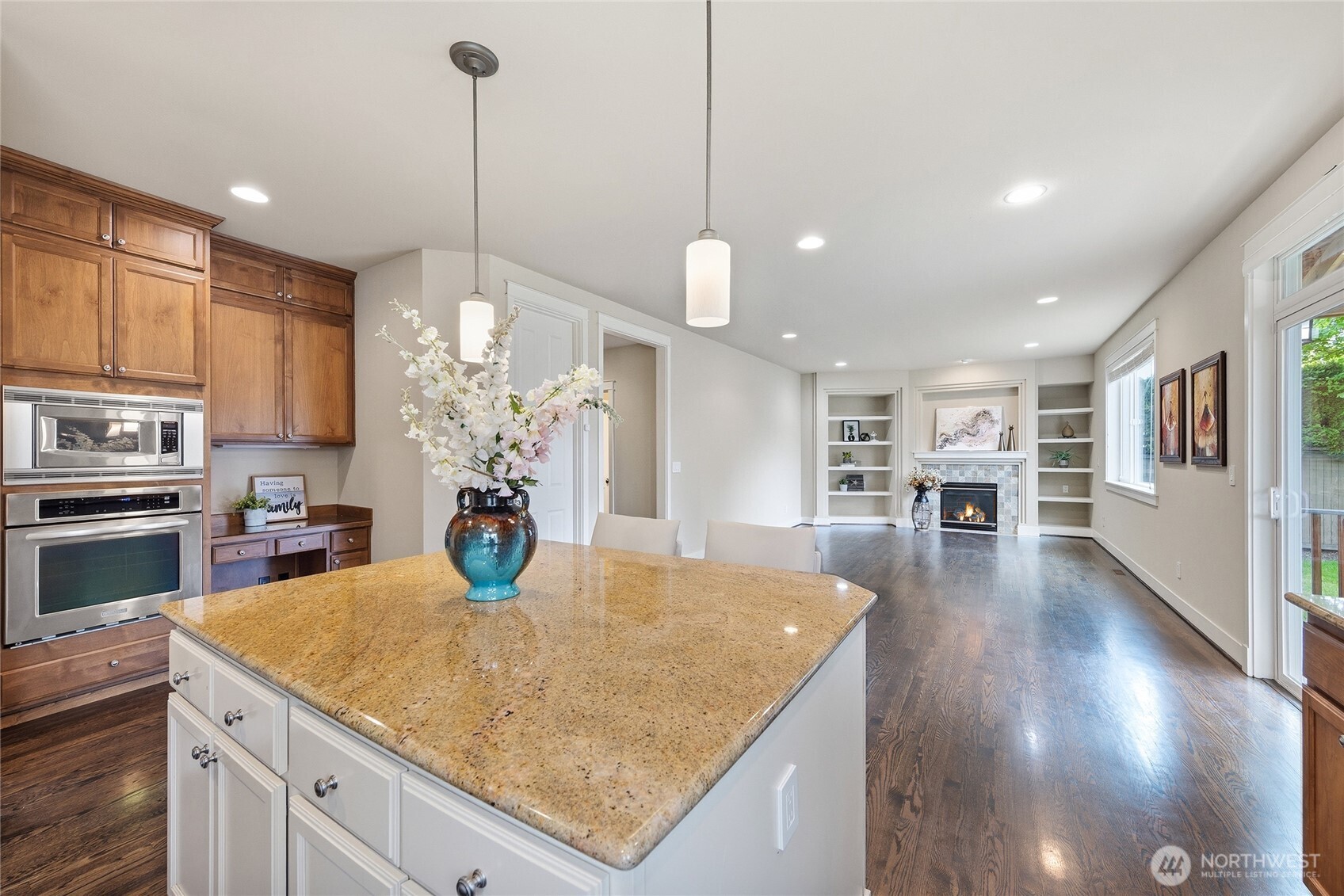 3514 184th Place Southeast Bothell, WA 98012 - Photo 14 of 39 a kitchen with stainless steel appliances granite countertop a kitchen island and a refrigerator
