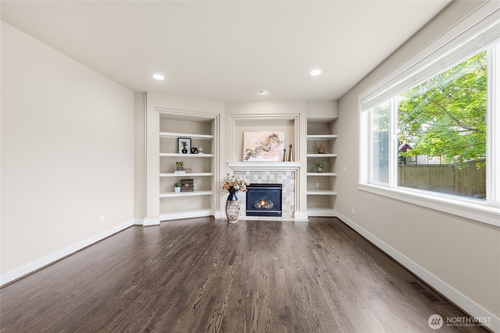 3514 184th Place Southeast Bothell, WA 98012 - Photo 18 of 39 wooden floor in an empty room with a fireplace