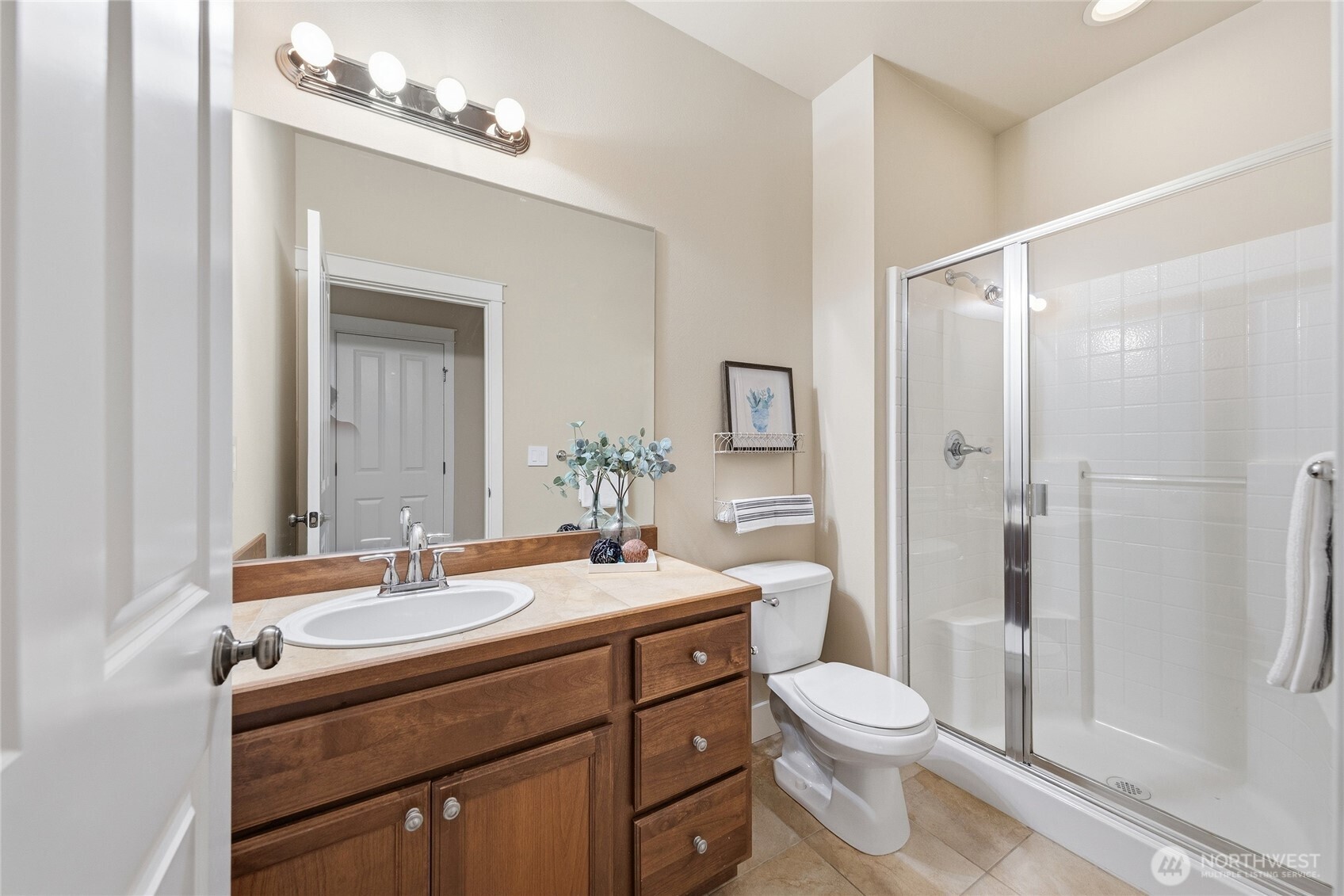 3514 184th Place Southeast Bothell, WA 98012 - Photo 21 of 39 a bathroom with a toilet a sink a mirror a shower a vanity and window