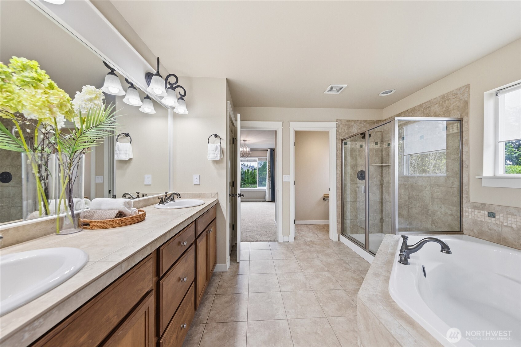 3514 184th Place Southeast Bothell, WA 98012 - Photo 26 of 39 a spacious bathroom with a granite countertop sink a mirror and a shower