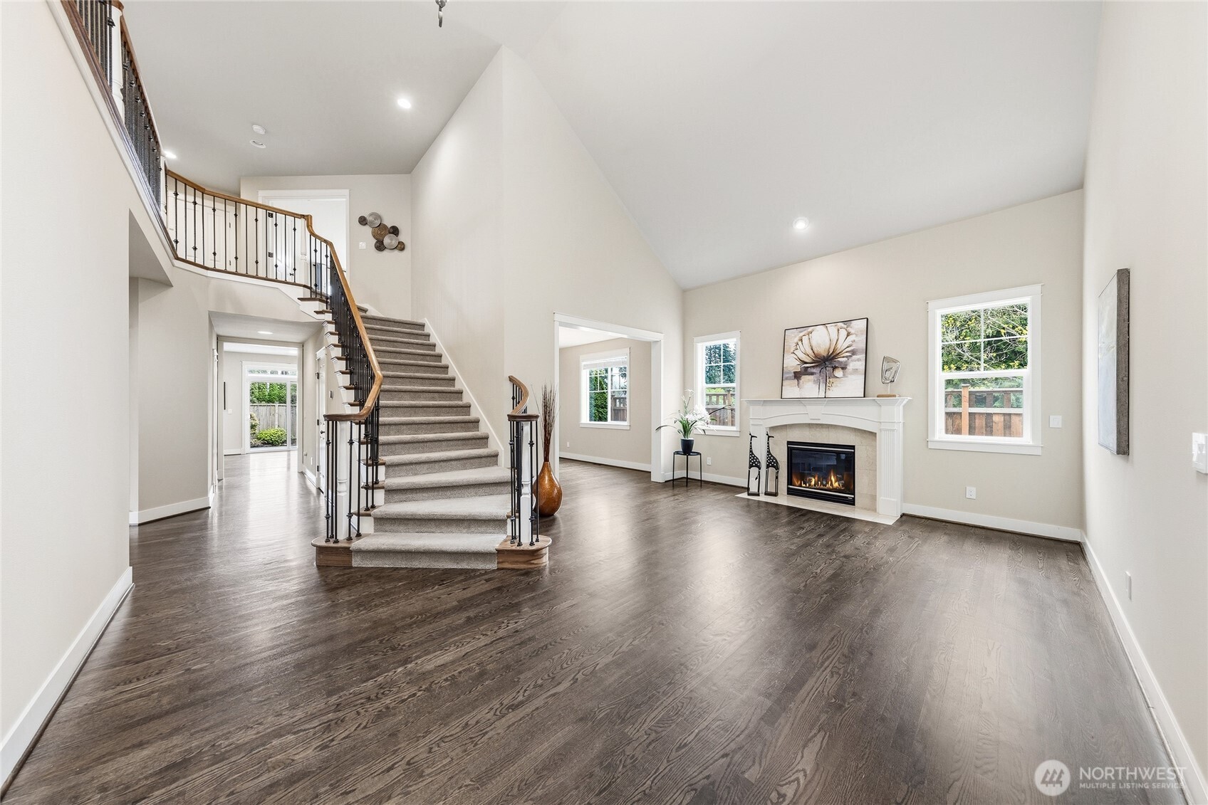 3514 184th Place Southeast Bothell, WA 98012 - Photo 3 of 39 a view of a livingroom with wooden floor and fireplace