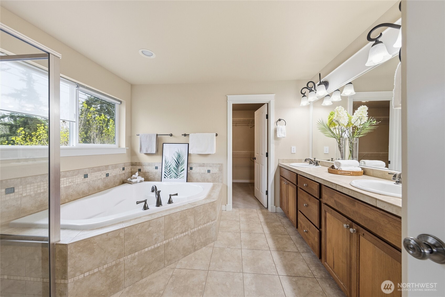 3514 184th Place Southeast Bothell, WA 98012 - Photo 9 of 39 a spacious bathroom with a tub sink and mirror