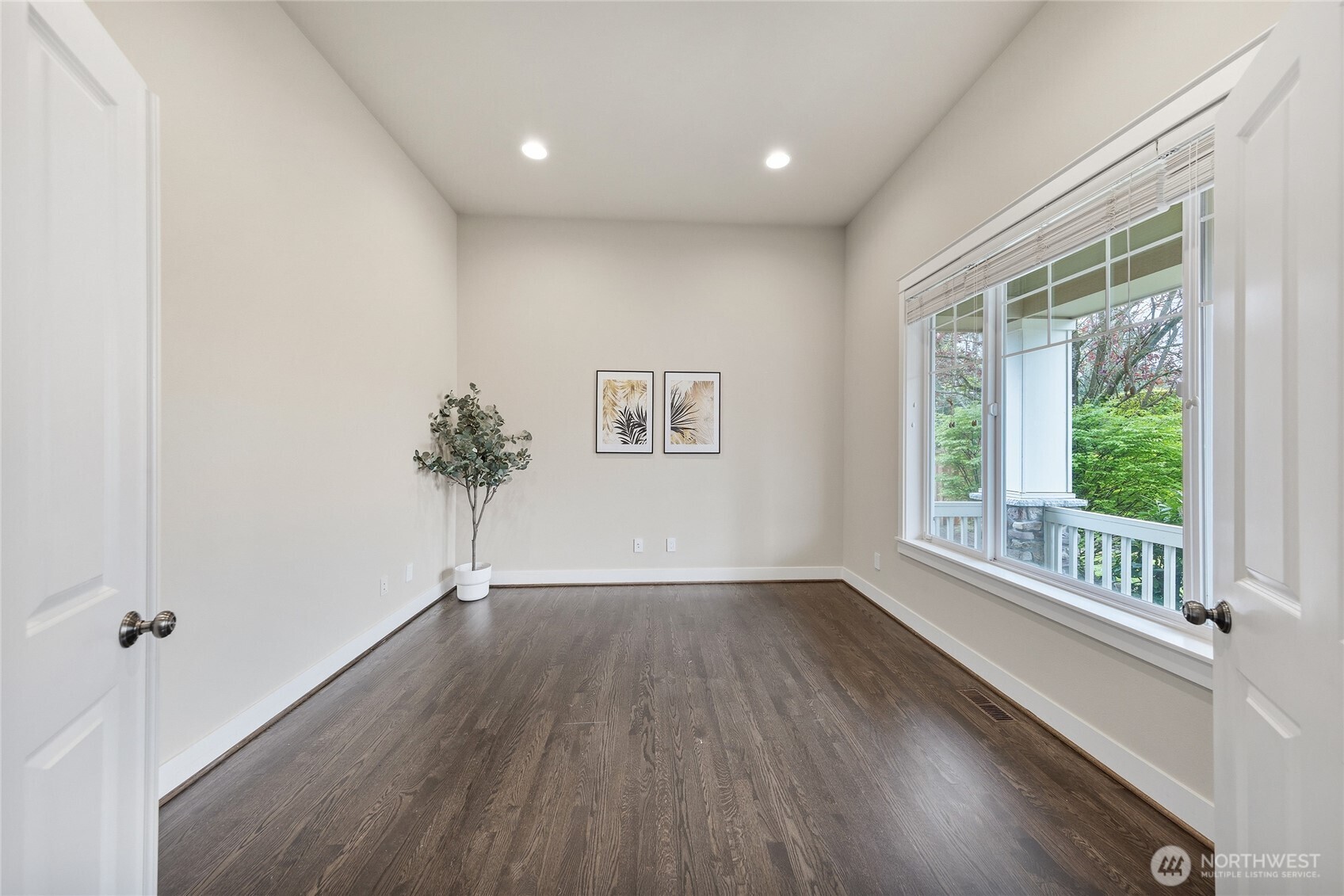 3514 184th Place Southeast Bothell, WA 98012 - Photo 10 of 39 a view of a big room with wooden floor and windows