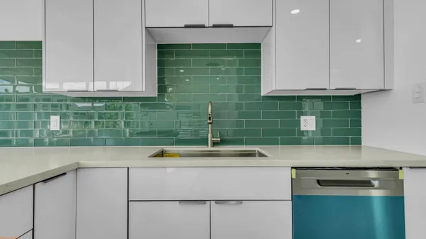 a kitchen with a sink and cabinets