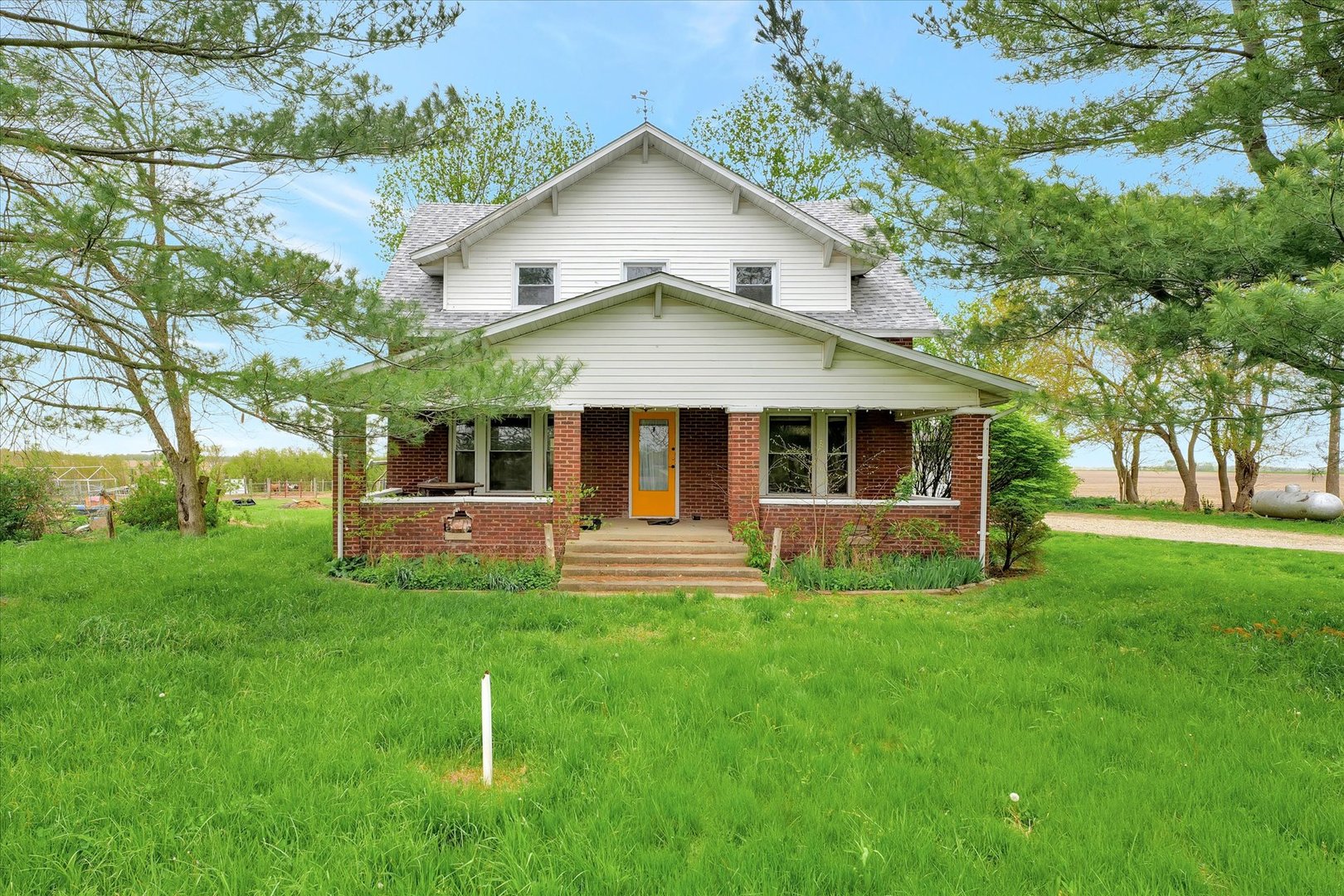 front view of a house with a yard