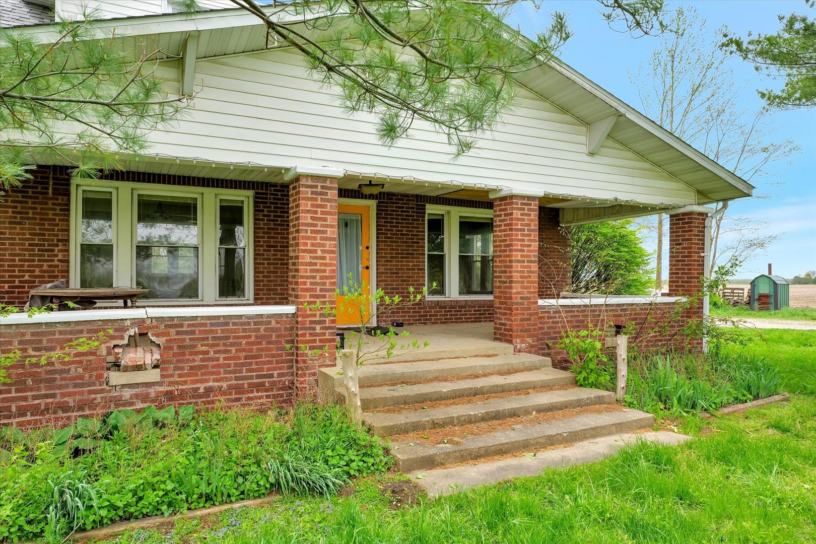 991 Lincoln Hwy Road Lerna, IL 62440 - Photo 3 of 31 a front view of a house with a garden and plants